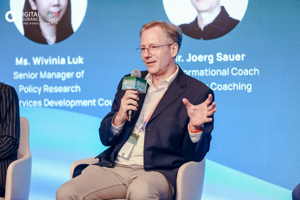 Joerg speaking at a conference